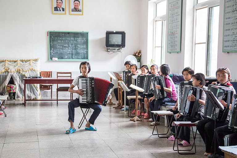 An accordion class at the Kaesong Childrens’ Palace, aka, extracurricular activity jail, where children are assigned activity or skill in the same way they will be assigned a job later in life. He’ll be a singer, she’ll play the accordion, and they will practice every single day of their lives.